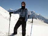 11 Jerome Ryan Trekking In The Snow With Tilicho Peak, Nilgiri, and Annapurna South Behind On Trail From Top Of Ridge Above Yak Kharka Towards Kalopani Around Dhaulagiri